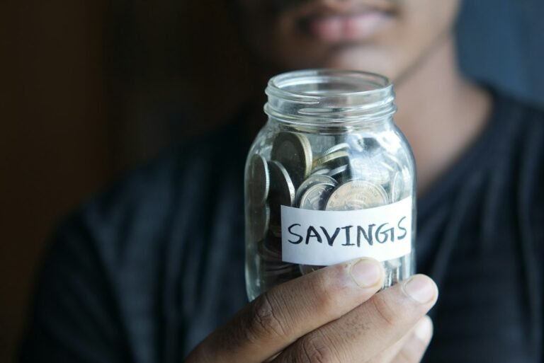 Savings jar representing building a first £1,000 emergency cash buffer