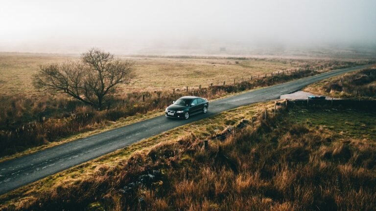 Car on a UK road representing car insurance renewal and quote comparison