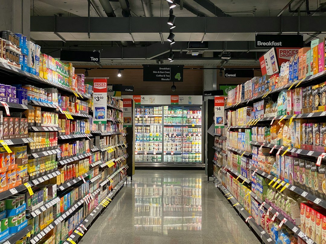 Supermarket shelves representing comparing branded and own-brand groceries