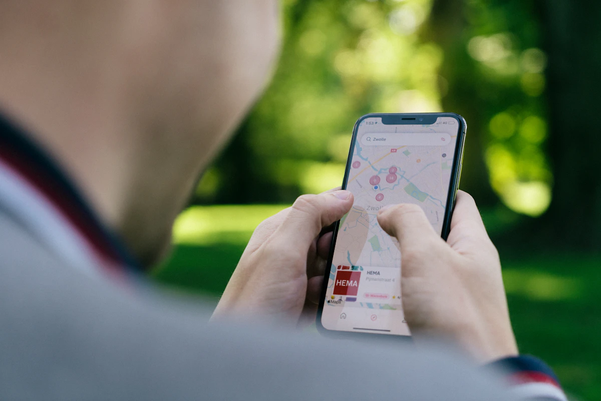 EU roaming for UK travellers: person holding a smartphone, illustrating holiday map preparation.