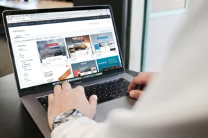 Person reviewing pages on a laptop before setting up an online shop