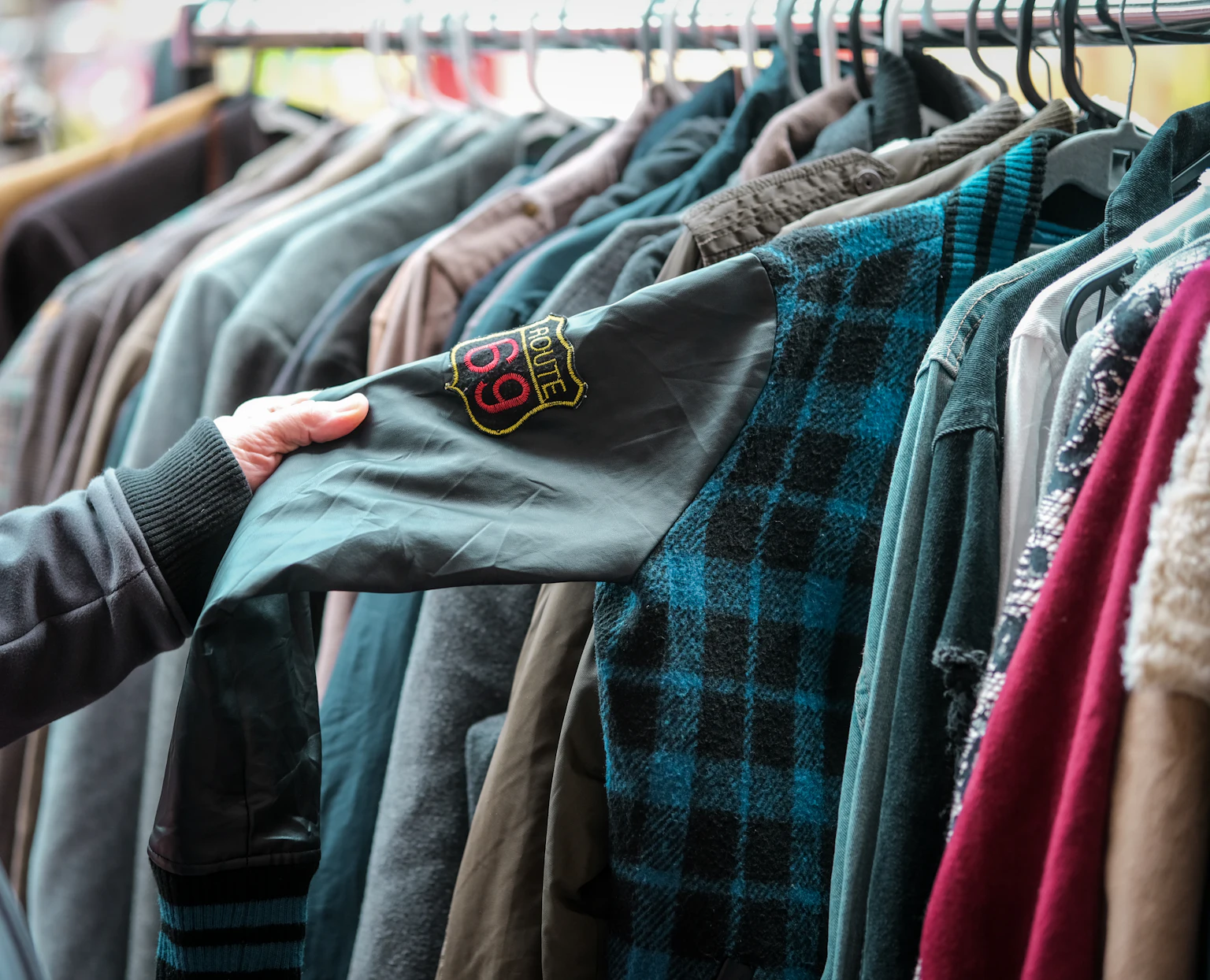 Second-hand clothes hanging on a rail