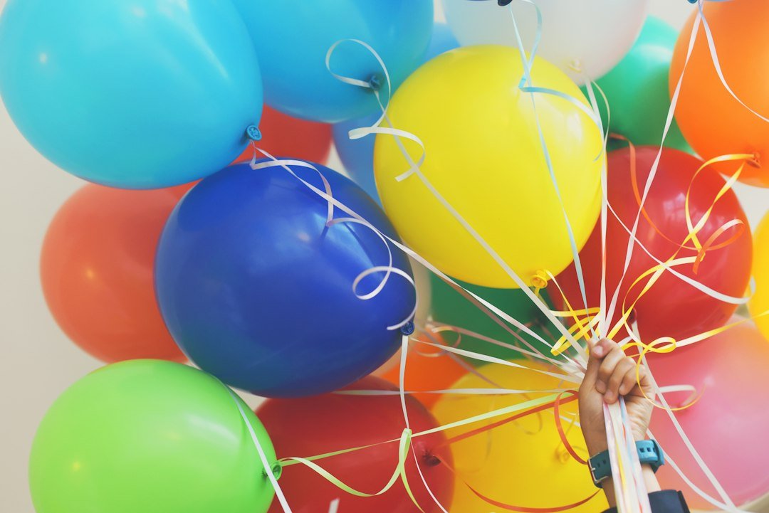 Colourful birthday balloons representing UK kids birthday freebies and rewards