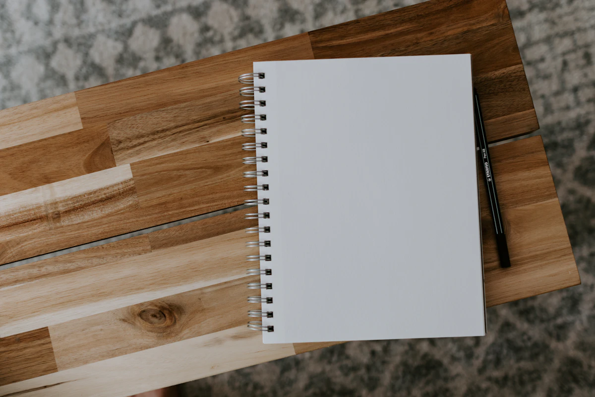 Notebook and pen for planning a shopping list and spending limit